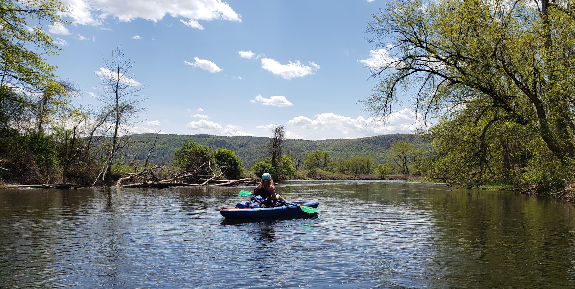 Paddler takes in the views of the Housatonic River in Lee, MA, that can be accessed due to the new canoe take-out site.